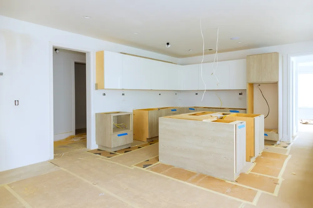 Installing,New,Custom,Kitchen,Cabinet,During,Construction,Of,Home,Improvement
