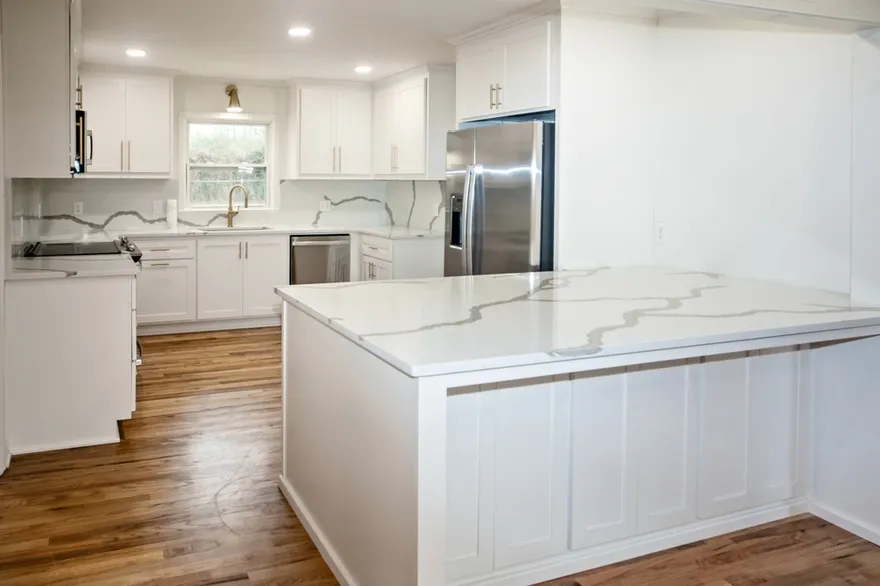 Light And Bright Newly Remodeled White Kitchen With Quartz Countertops