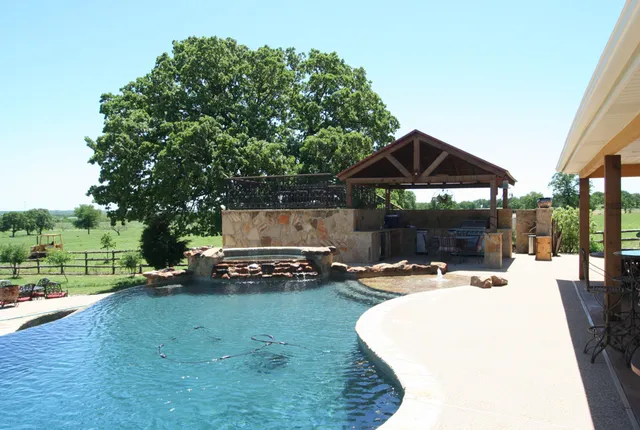 Backyard pool and outdoor living space built by The Rockaway Company