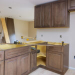 Furniture,Assembling,Of,Custom,New,Cabinets,In,Modern,Kitchen