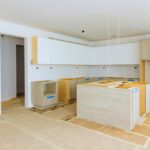 Installing,New,Custom,Kitchen,Cabinet,During,Construction,Of,Home,Improvement